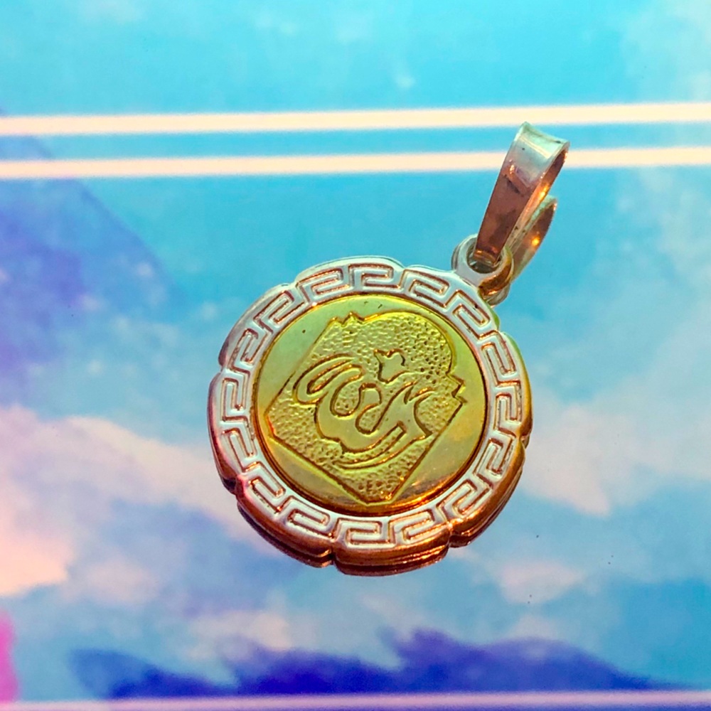 Gold and silver Arabic charm